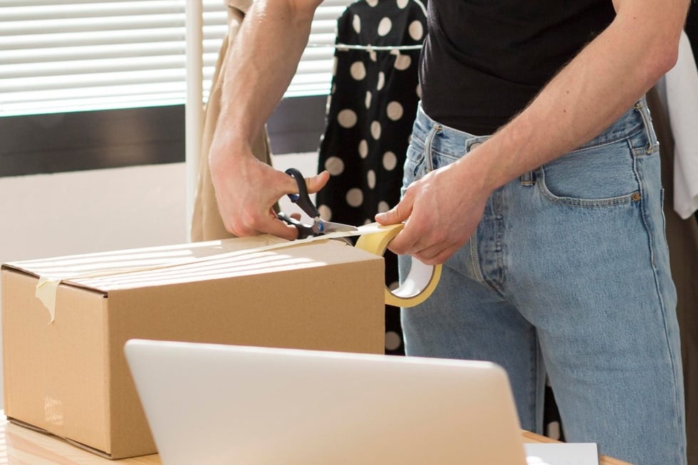 person packaging a return