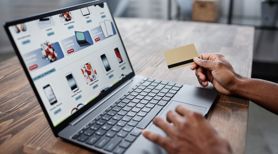 Online shopping with card on laptop computer during peak trading period