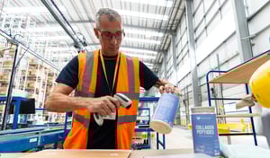 Warehouse worker scanning products